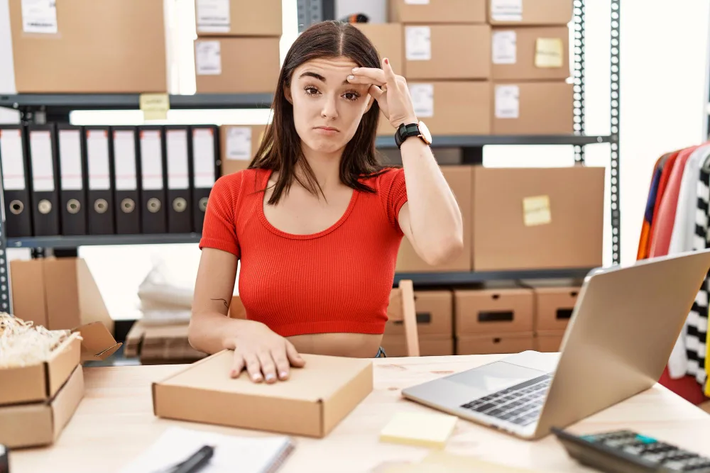 Drop shipper working in her warehouse