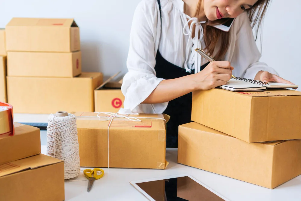 Woman packing dropshipping package